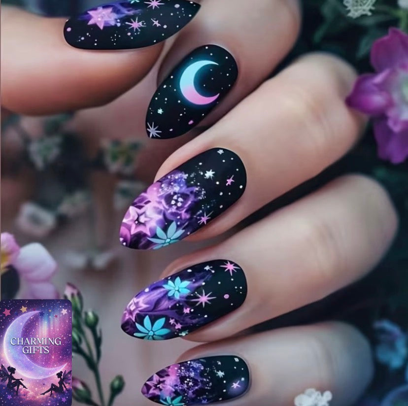 The Lady's Manicure Features a Black Base Mixed with Dreamy Hues, in an Almond-shaped Medium-length Style. It Is Designed with Magical Patterns Such as , Moons, and Stars, and Has a Matte Finish on the Surface.